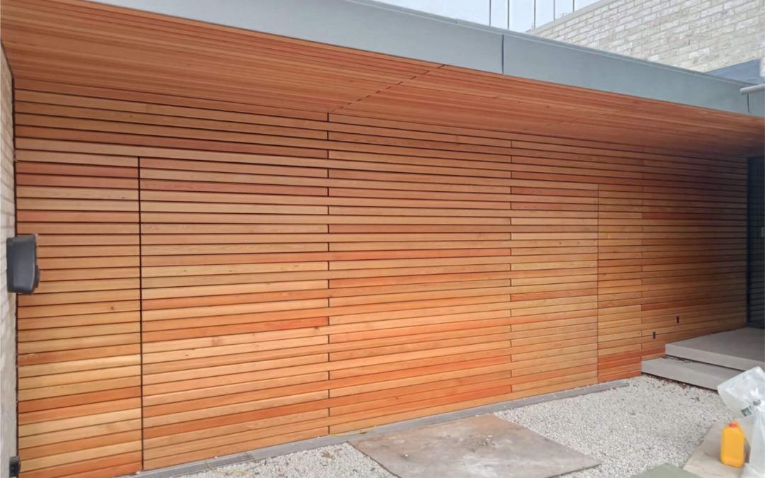 Enhanced garage with a door that was durable, attractive, and easy to operate